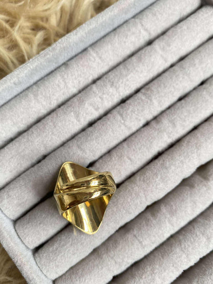 Pyakha Angu Rings on a textured gray surface