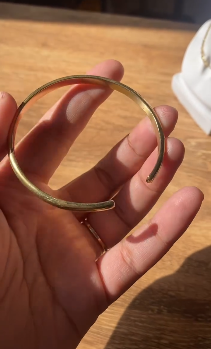 Crafted from high-quality, durable Panchadhatu metal, this minimalist bracelet boasts a sleek gold finish that radiates understated elegance. Designed for any occasion, from casual outings with friends to complementing your daily wear, this bracelet seamlessly enhances any outfit.