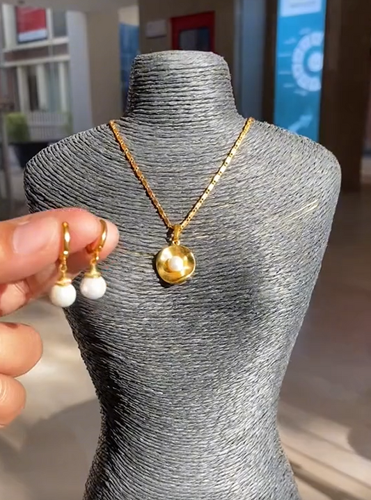 Elegant pearl earring and necklace set in gold tone - timeless jewelry for sophisticated style