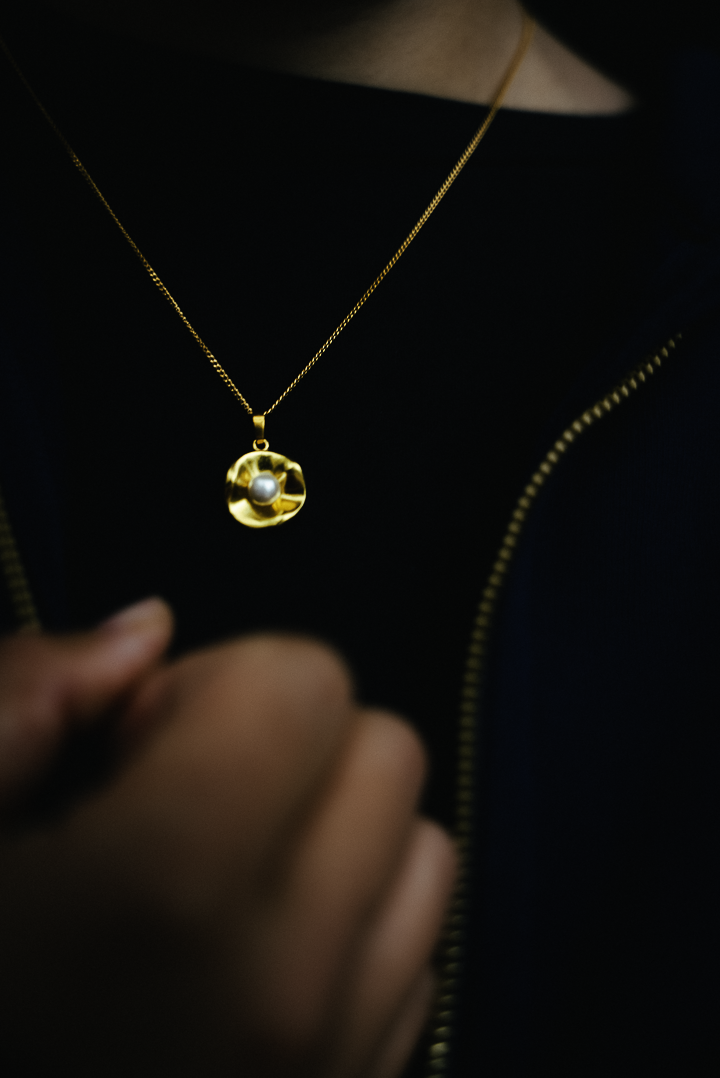 Close-up of oyster pendant showing refined detailing - sophisticated necklace for everyday wear