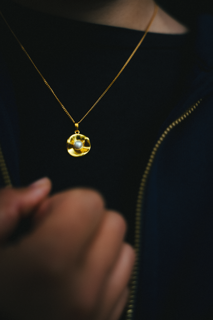 Close-up of oyster pendant showing refined detailing - sophisticated necklace for everyday wear