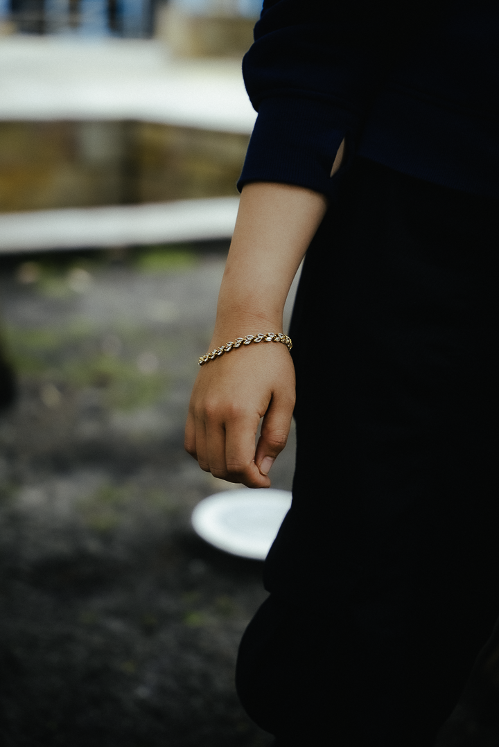 Person wearing a bracelet with a blurred background