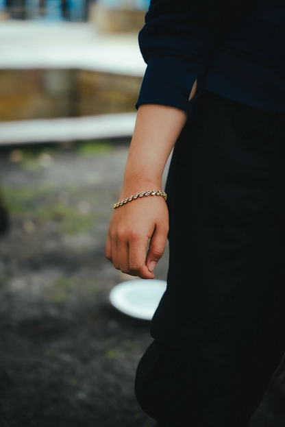 Person wearing a bracelet with a blurred background