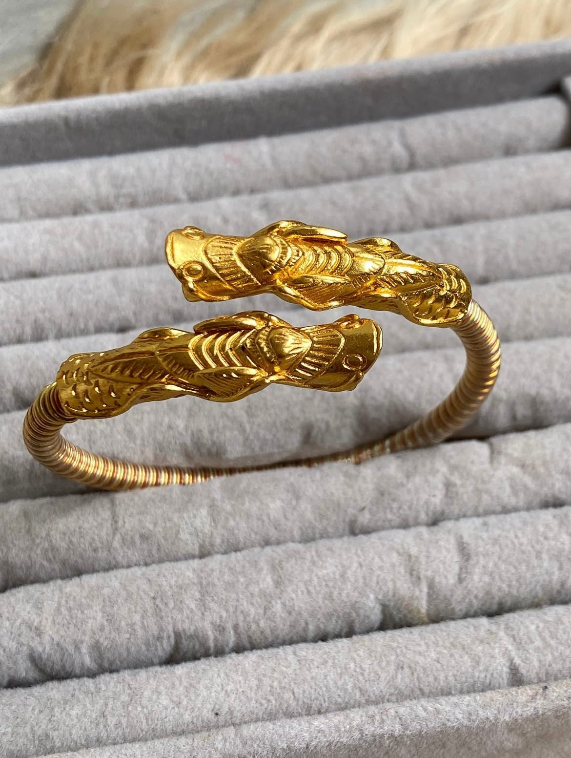 Close-up of Sin:Khwa Bala showing intricate lion design and traditional metalwork craftsmanship