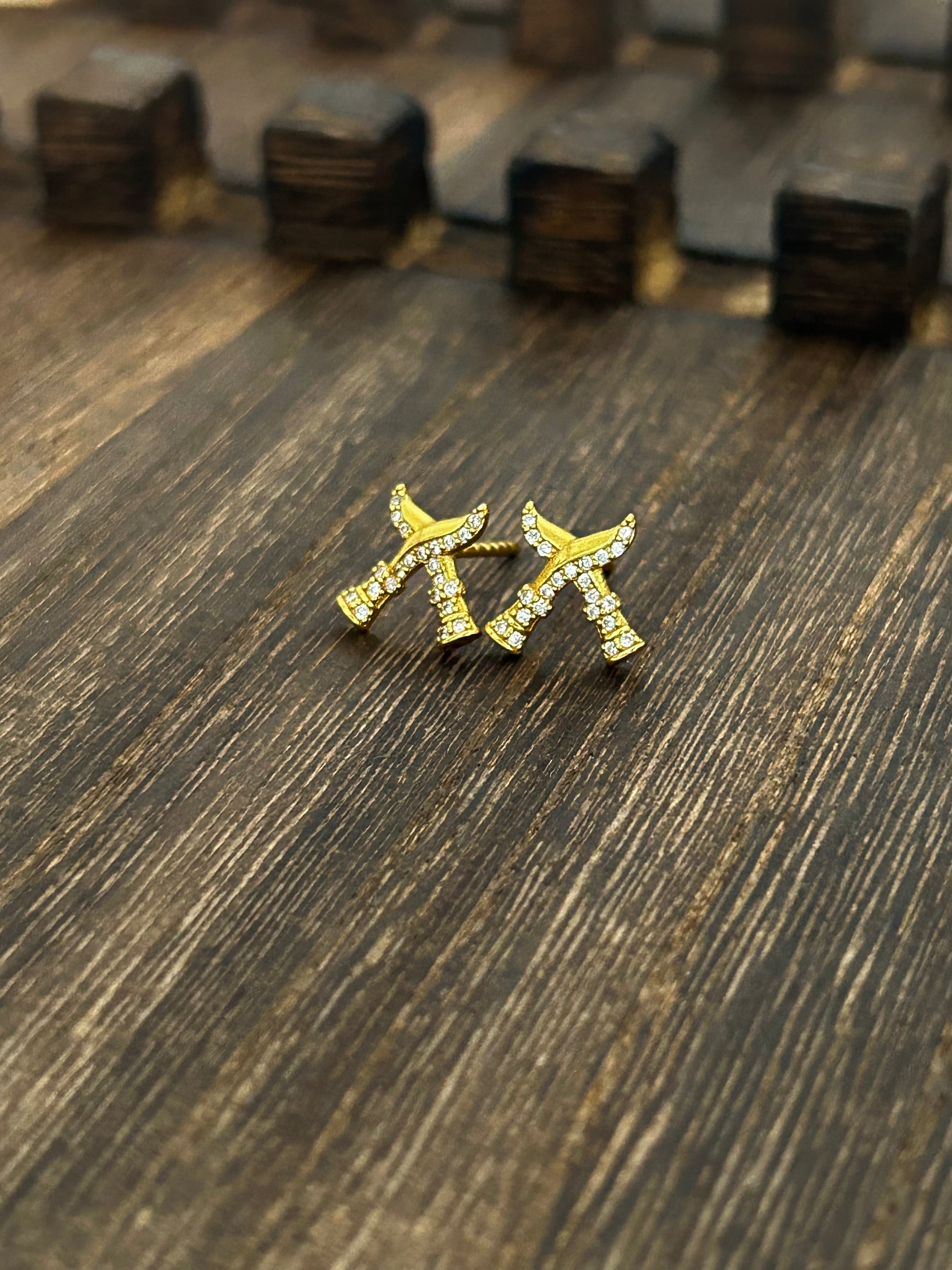 Khukuri studs on a wooden surface