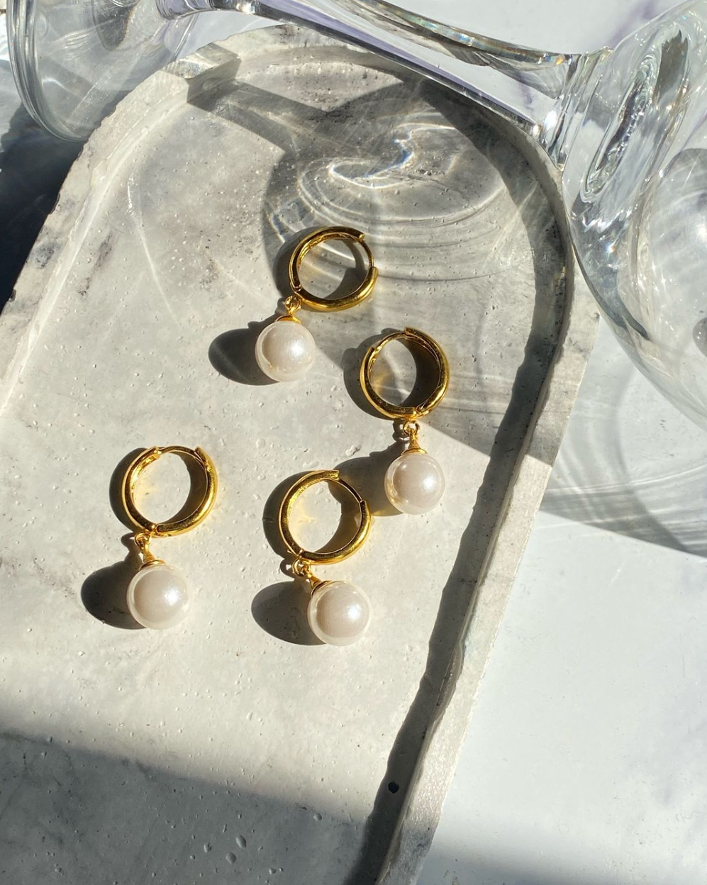 Classic pearl hoop earrings with elegant design - timeless jewelry for sophisticated style
