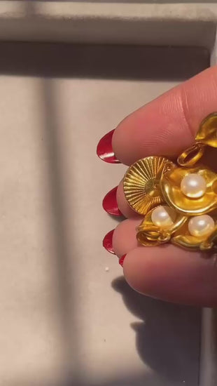 Close-up video of oyster pendant showing refined detailing