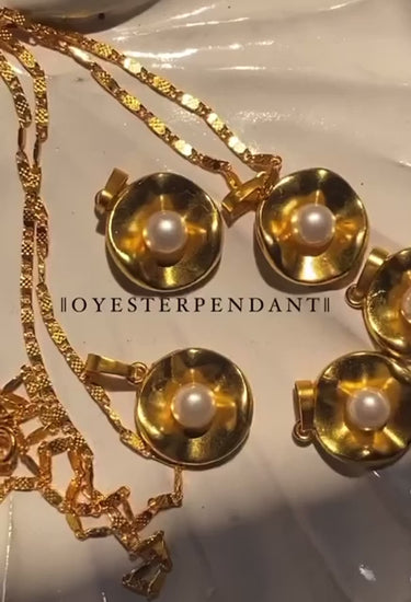 Oyster pendant necklace in gold tone - elegant pearl jewelry with timeless design